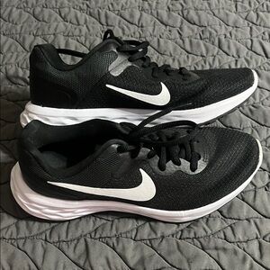 Nike Women’s Black and White Revolution Athletic Sneakers